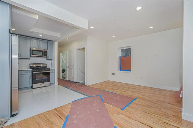 a bedroom with a bed and cabinets