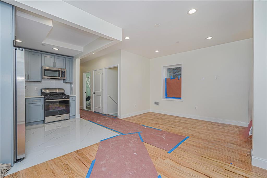 160 Bay 29th Street Brooklyn, NY 11214 - Photo 5 of 27 a bedroom with a bed and cabinets