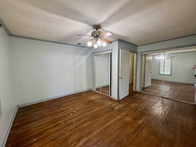 a view of an empty room with glass door