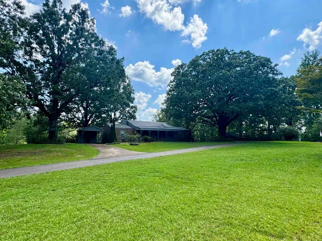 a view of a golf course with a big yard