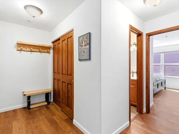 a view of room with furniture and wooden floor