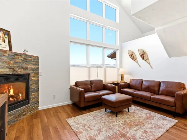 a living room with furniture a couch and a fireplace