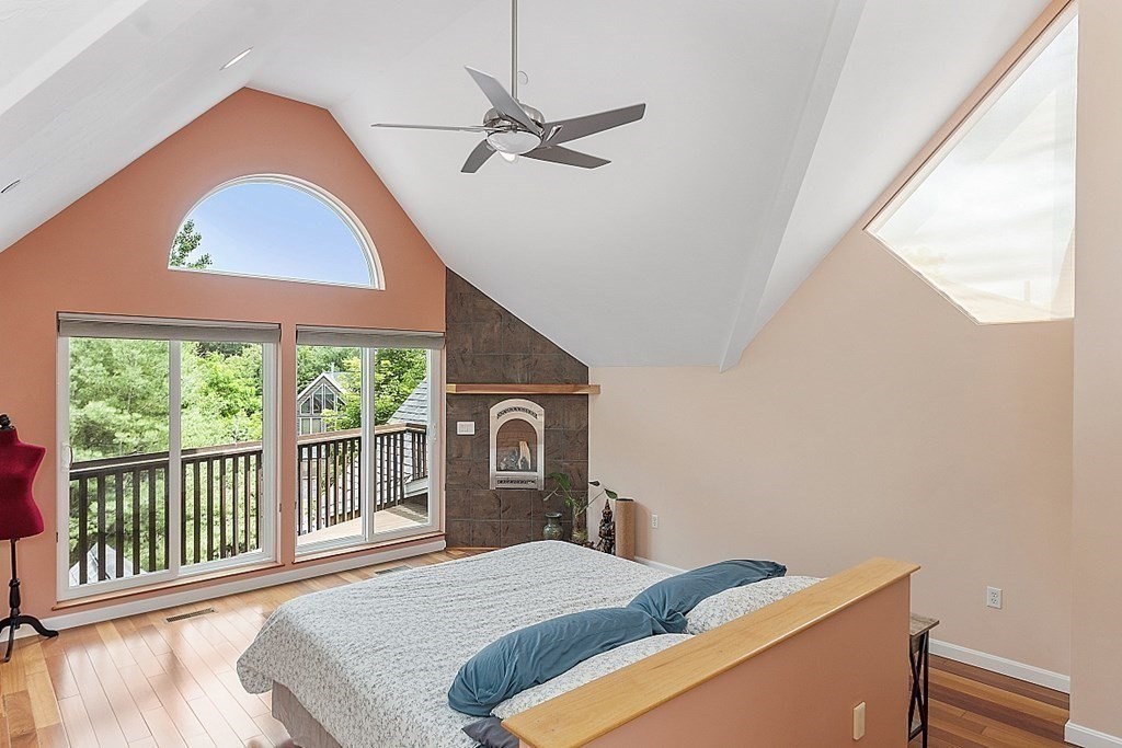 47 Deer Path, Unit 47 Hudson, MA 01749 - Photo 14 of 42 a bedroom with a bed and a large window