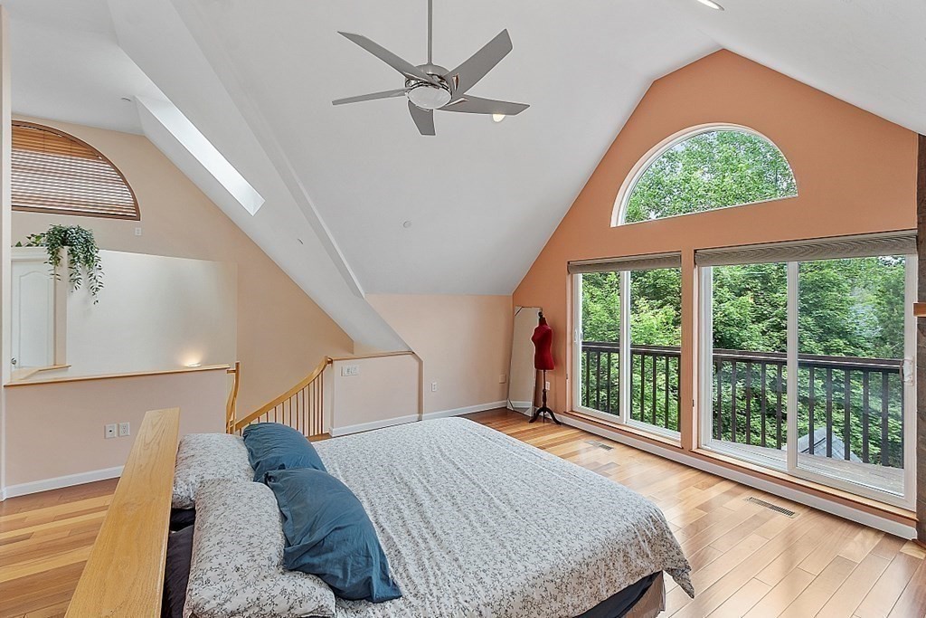 47 Deer Path, Unit 47 Hudson, MA 01749 - Photo 15 of 42 a bedroom with a large bed and a large window