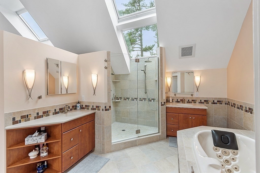 47 Deer Path, Unit 47 Hudson, MA 01749 - Photo 16 of 42 a bathroom with a shower a sink and a mirror