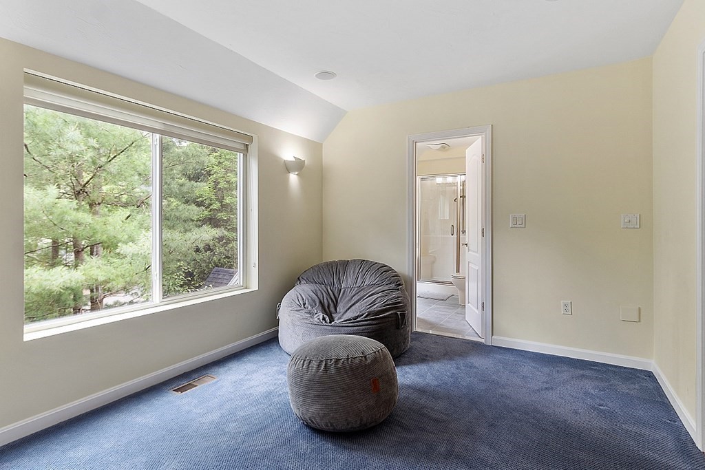 47 Deer Path, Unit 47 Hudson, MA 01749 - Photo 21 of 42 a living room with furniture and a large window