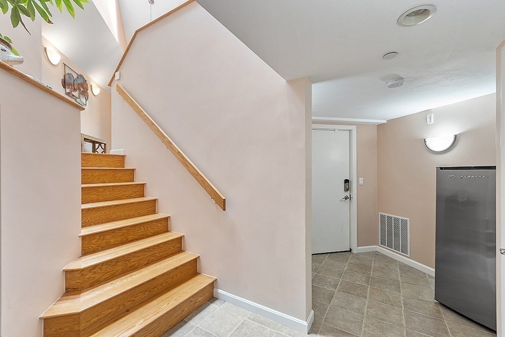 47 Deer Path, Unit 47 Hudson, MA 01749 - Photo 25 of 42 a view of entryway and hall with wooden floor