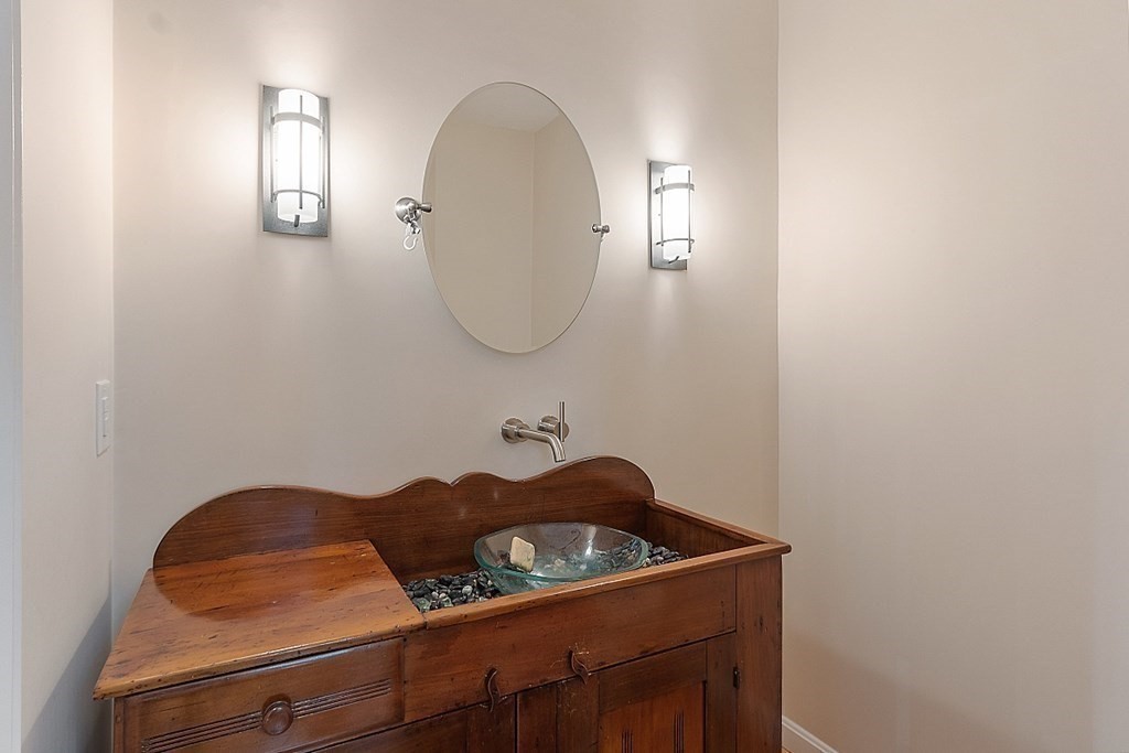 47 Deer Path, Unit 47 Hudson, MA 01749 - Photo 26 of 42 a bathroom with a sink and a mirror