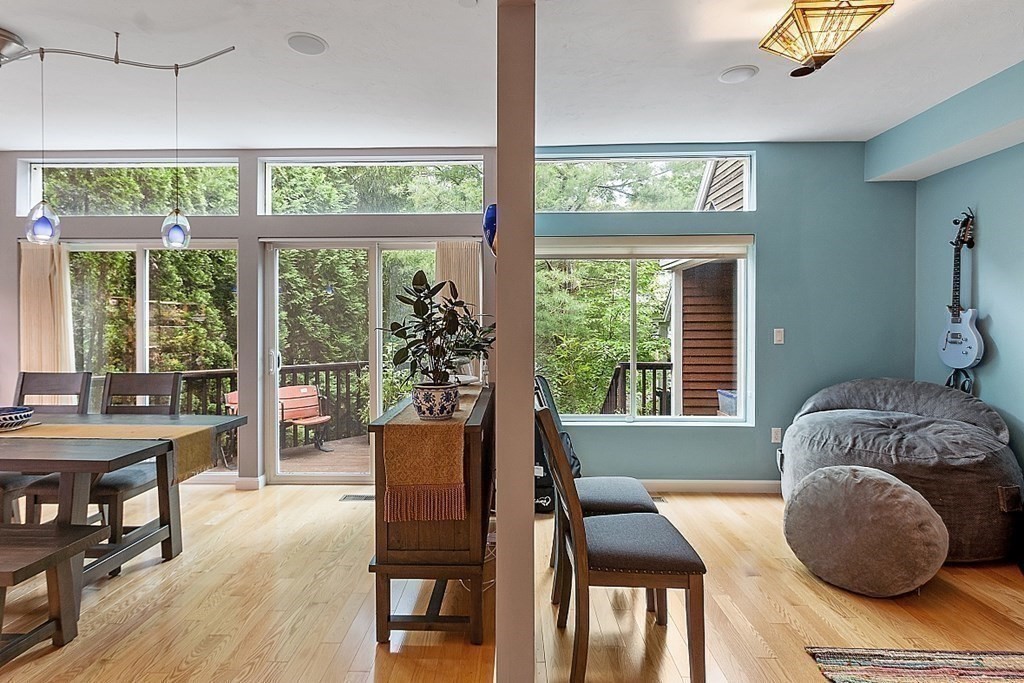 47 Deer Path, Unit 47 Hudson, MA 01749 - Photo 27 of 42 a living room with furniture and large windows