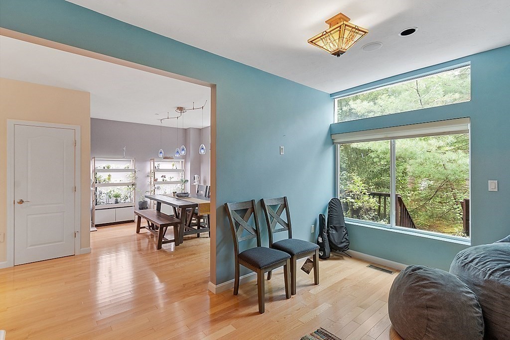 47 Deer Path, Unit 47 Hudson, MA 01749 - Photo 28 of 42 a living room with furniture and a large window