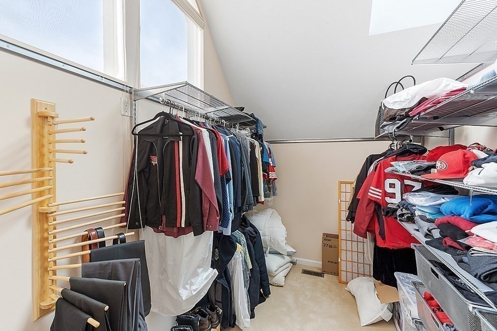 47 Deer Path, Unit 47 Hudson, MA 01749 - Photo 29 of 42 a view of walk in closet with clothes and shoes