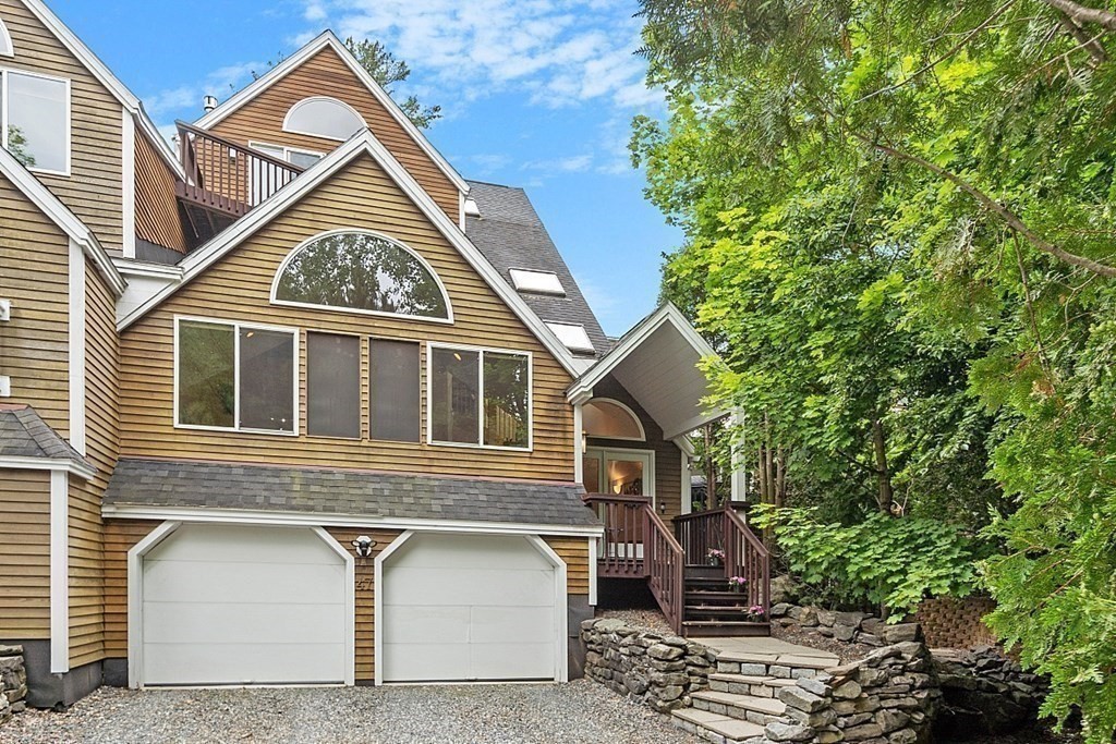 47 Deer Path, Unit 47 Hudson, MA 01749 - Photo 3 of 42 a front view of a house with garden
