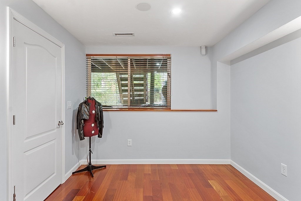 47 Deer Path, Unit 47 Hudson, MA 01749 - Photo 36 of 42 wooden floor in an empty room with a window