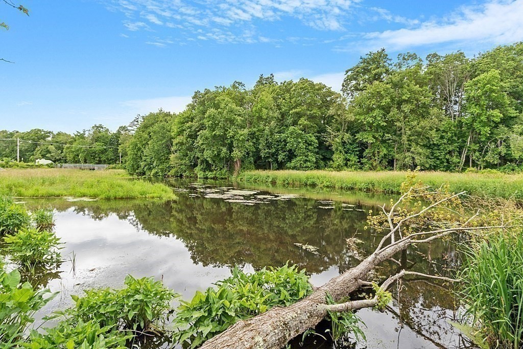 47 Deer Path, Unit 47 Hudson, MA 01749 - Photo 39 of 42 a view of a lake with a yard