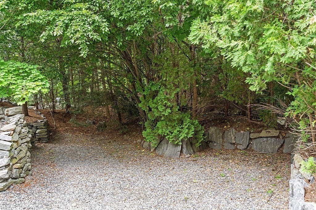 47 Deer Path, Unit 47 Hudson, MA 01749 - Photo 41 of 42 a view of a yard with plants and trees