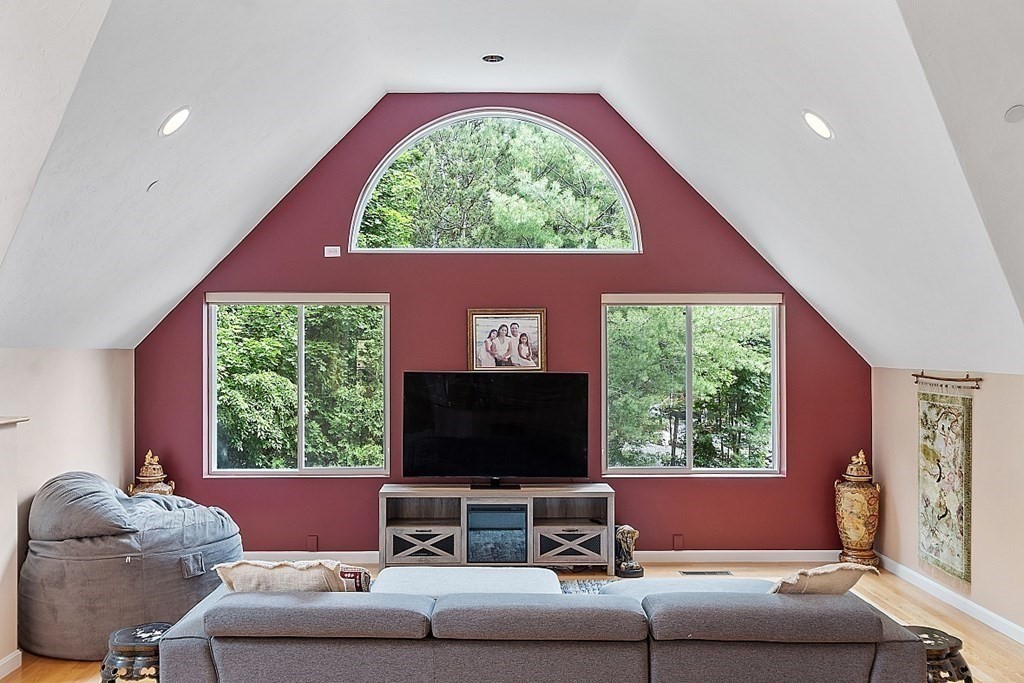 47 Deer Path, Unit 47 Hudson, MA 01749 - Photo 7 of 42 a living room with furniture and a flat screen tv