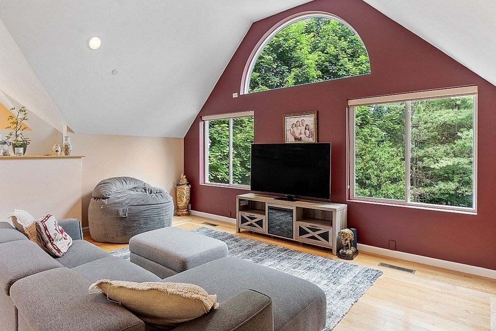 47 Deer Path, Unit 47 Hudson, MA 01749 - Photo 8 of 42 a living room with furniture and a flat screen tv