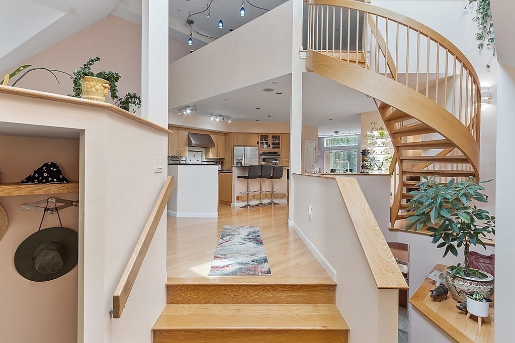 47 Deer Path, Unit 47 Hudson, MA 01749 - Photo 9 of 42 a view of a hallway with furniture and toys