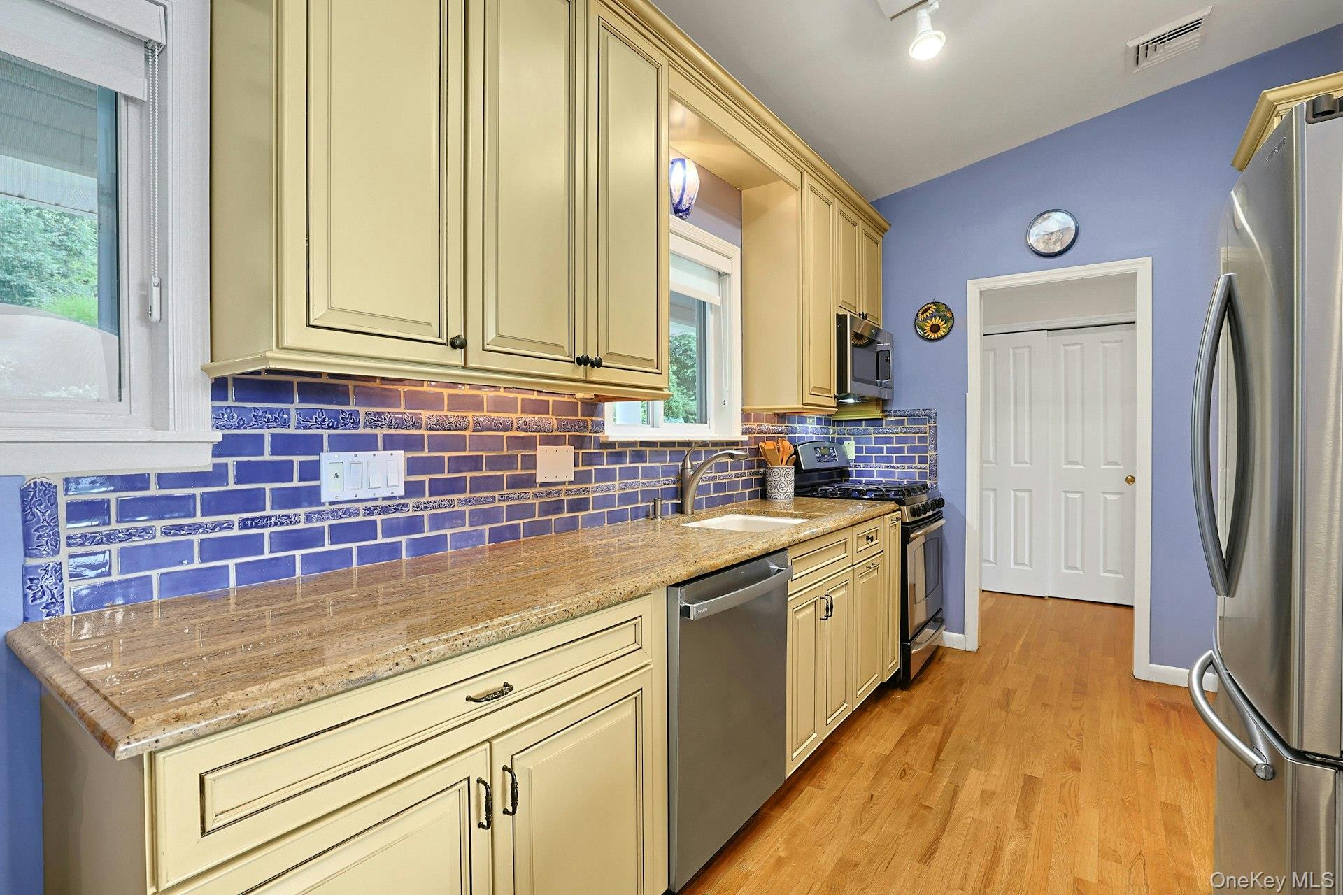 11 Lakeside Road Mahopac, NY 10541 - Photo 16 of 48 Custom tiles in kitchen made by Rosanne Breuer, Master Potter.