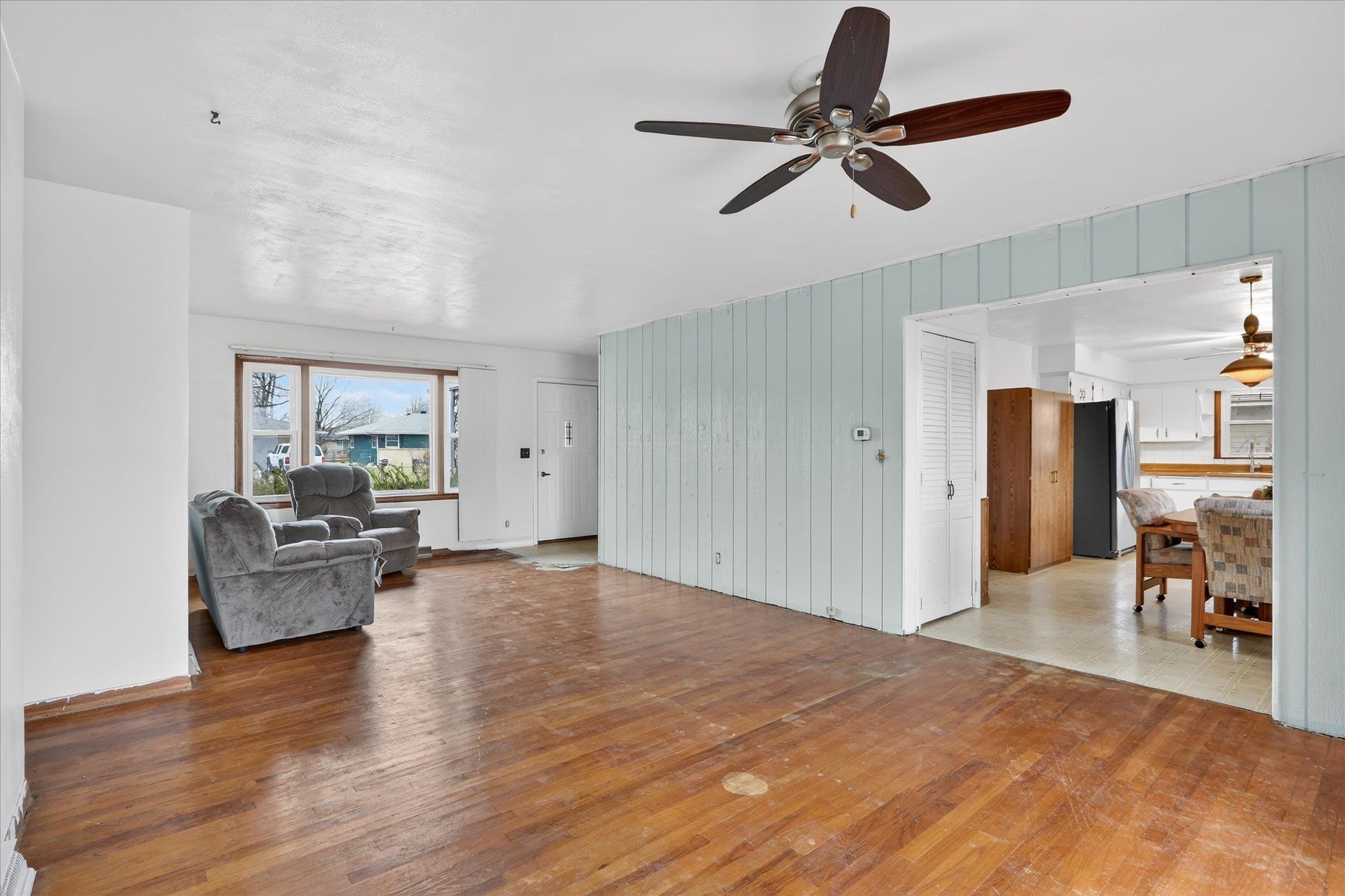 6962 Ralph Road Rockford, IL 61109 - Photo 11 of 35 a living room with furniture and a wooden floor