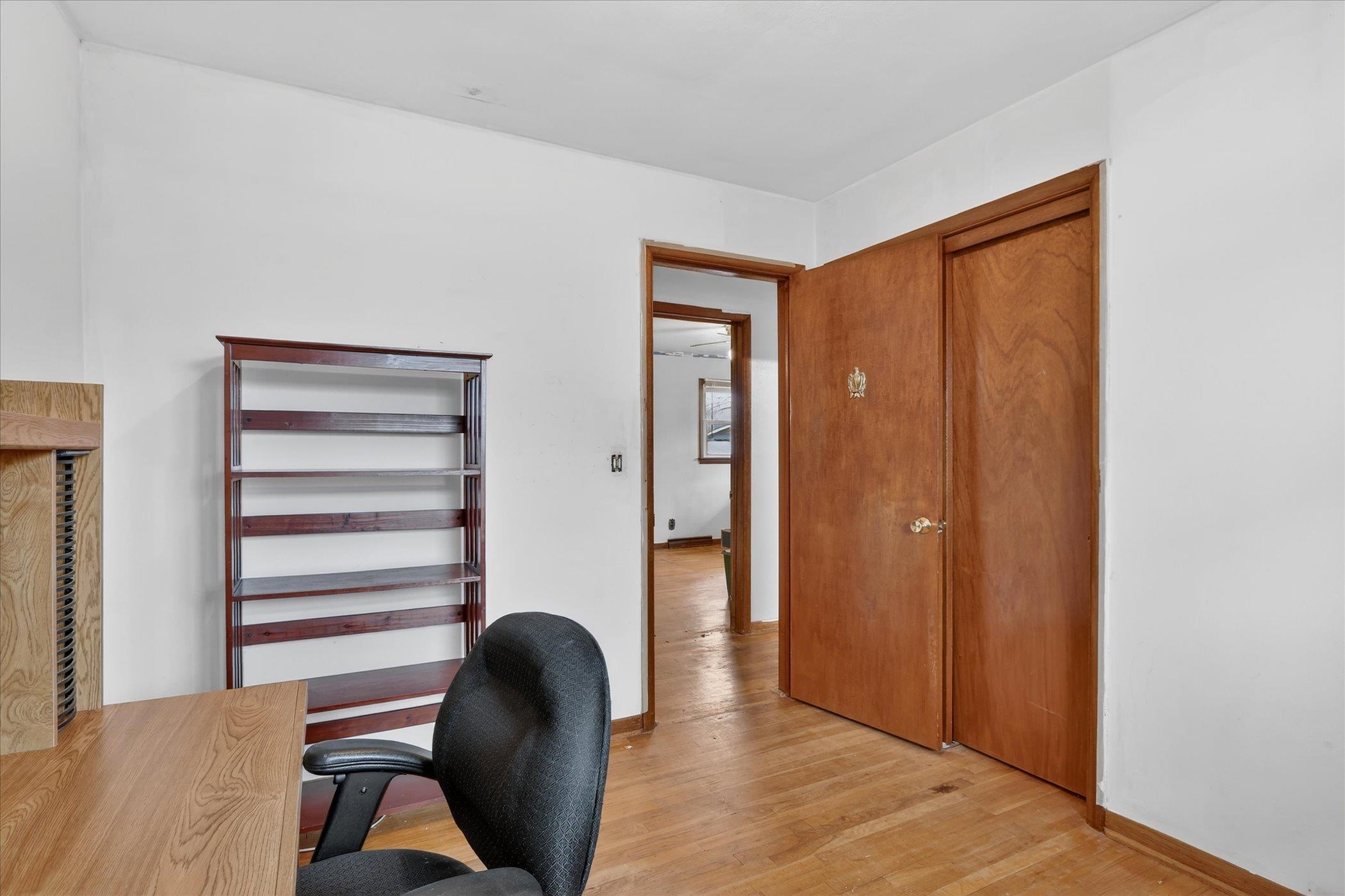 6962 Ralph Road Rockford, IL 61109 - Photo 20 of 35 a view of a bedroom with wooden floor and windows