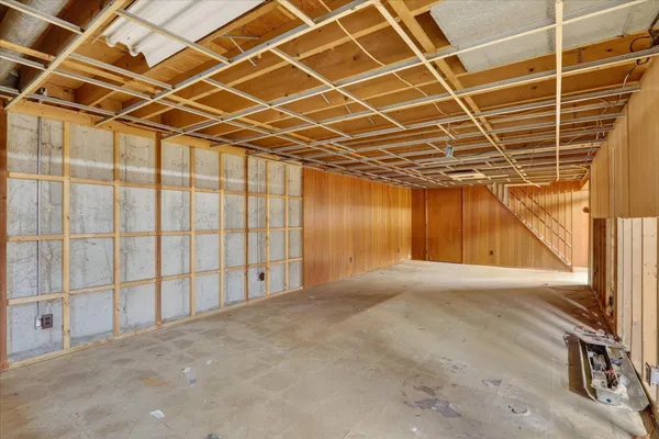 a view of a room with wooden walls