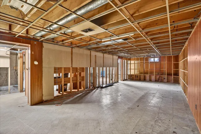 a view of a room with wooden walls