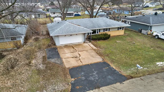 a view of a house with a yard