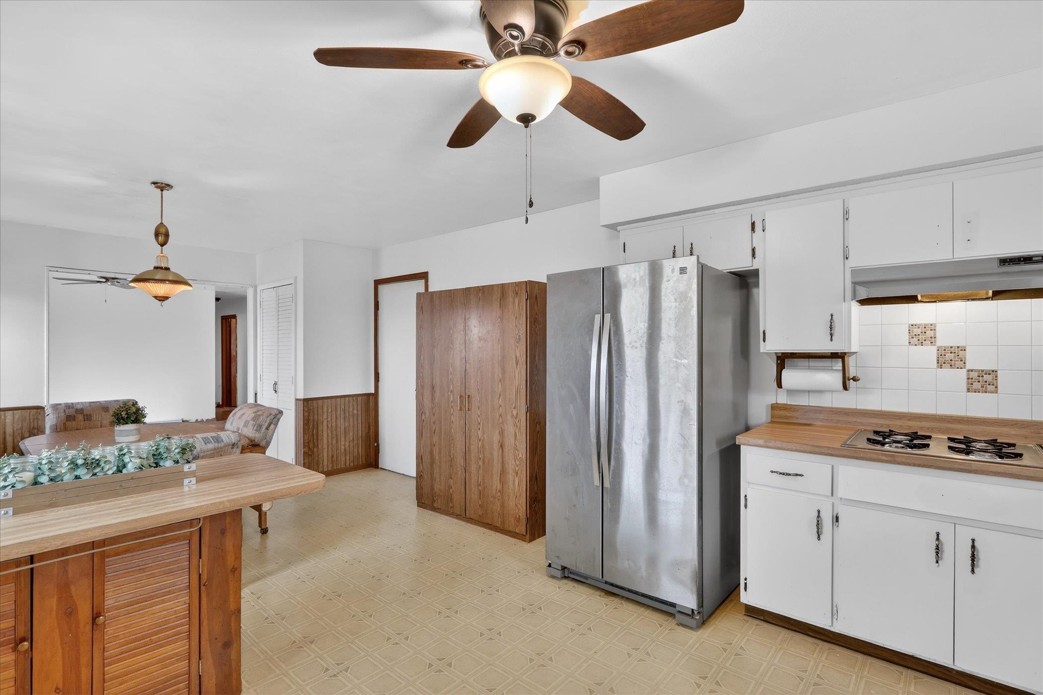 6962 Ralph Road Rockford, IL 61109 - Photo 6 of 35 a kitchen with stainless steel appliances granite countertop a refrigerator a sink and white cabinets