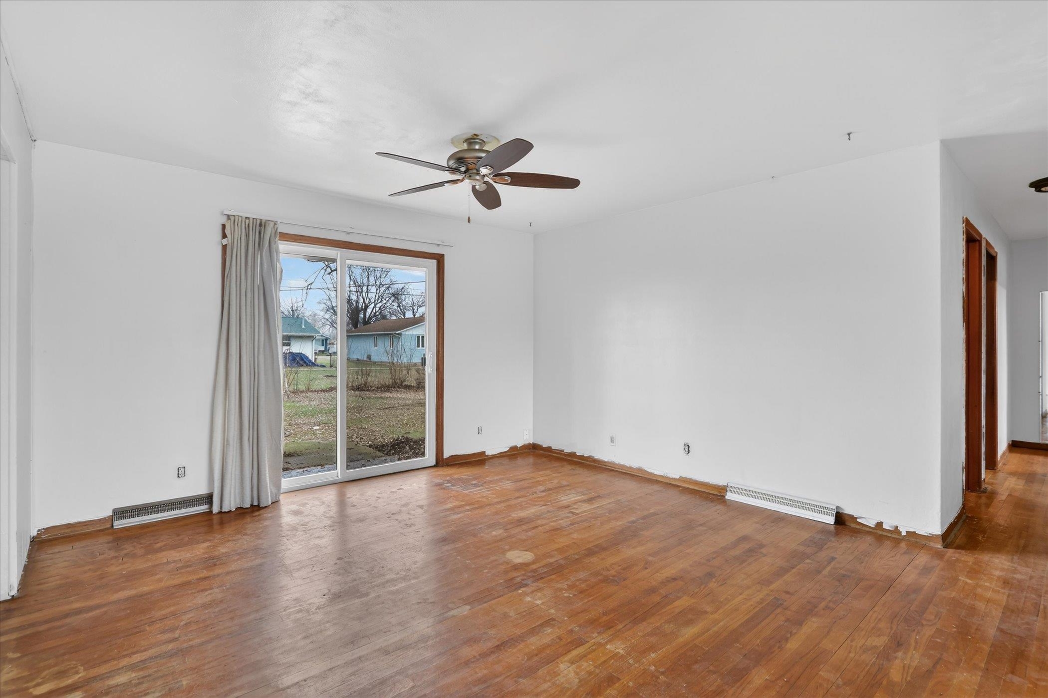 6962 Ralph Road Rockford, IL 61109 - Photo 10 of 35 a view of empty room with wooden floor and fan
