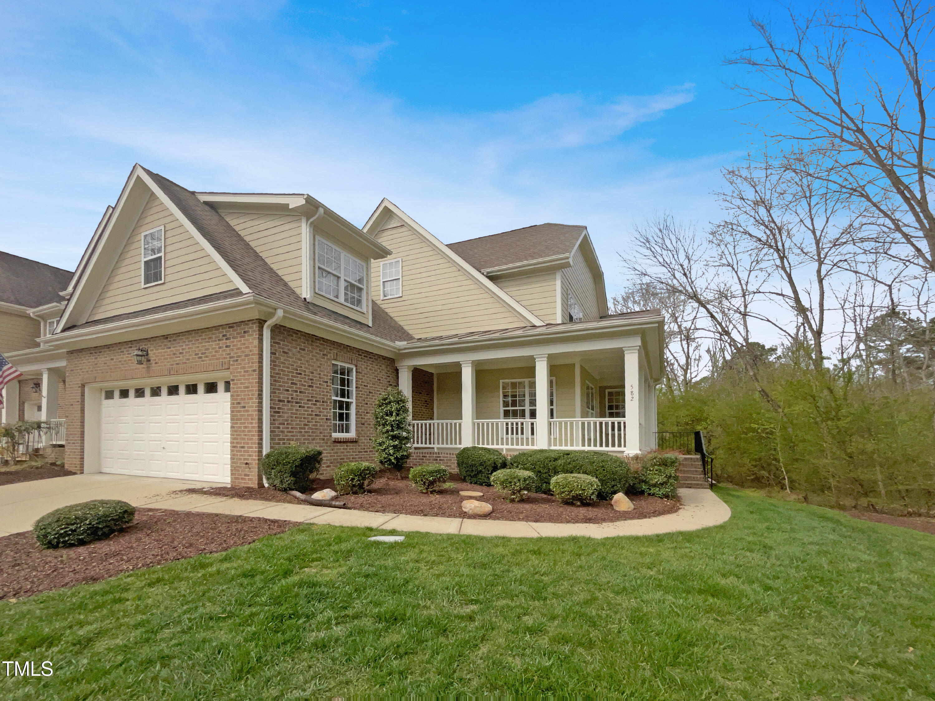 582 Canvas Drive Wake Forest, NC 27587 - Photo 1 of 16 a front view of a house with a yard and porch