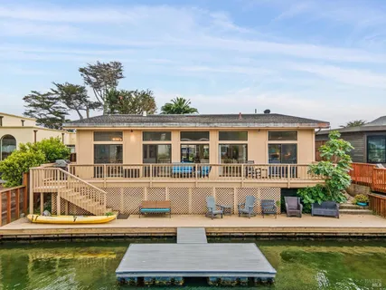 a house with swimming pool in front of it