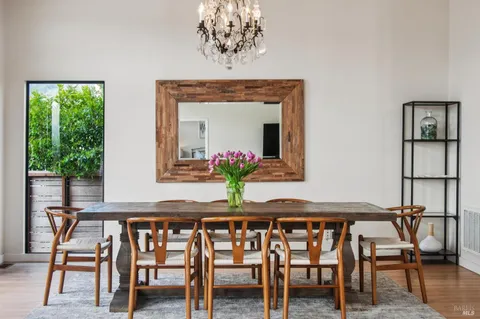 a dining room with furniture and window