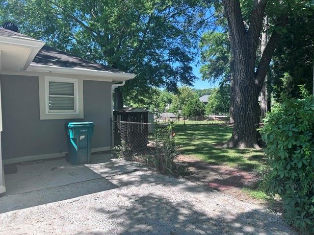 1261 Concord Road Southeast Smyrna, GA 30080 - Photo 39 of 50 a view of a small house and a yard