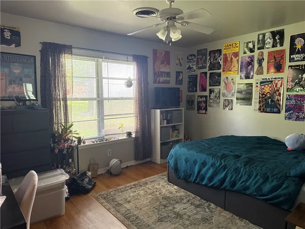 a bedroom with a bed furniture and a window