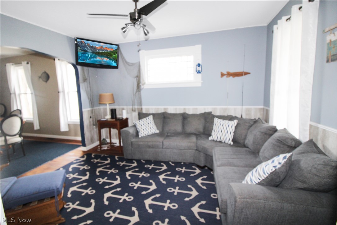 407 Fremont Road Port Clinton, OH 43452 - Photo 7 of 22 Living room featuring ceiling fan and a healthy amount of sunlight