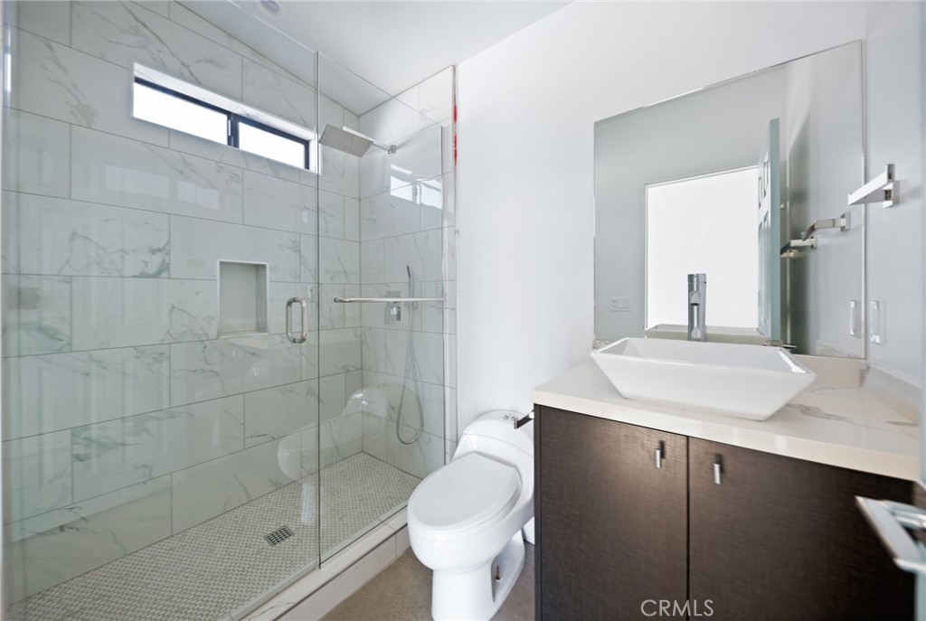 4955 1st Street East Joshua Tree, CA 92252 - Photo 8 of 10 a bathroom with a sink toilet and shower