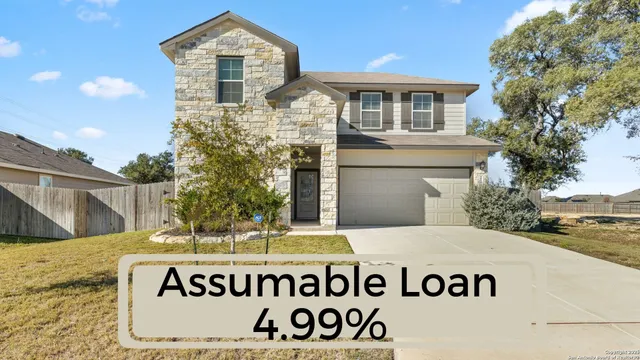 a front view of a house with a sign broad