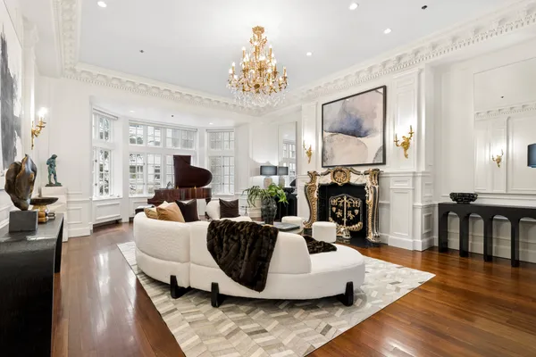 a large white kitchen with a large window