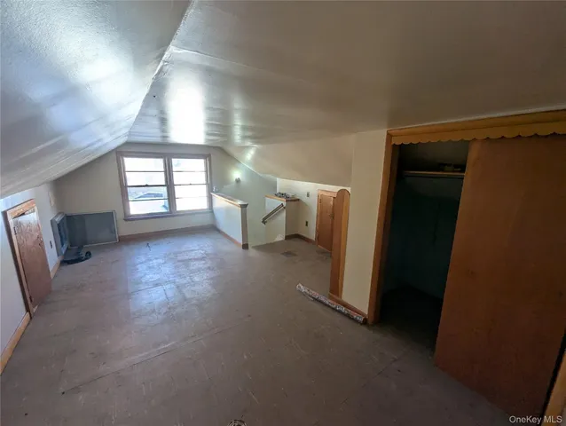 a view of a hallway view with staircase