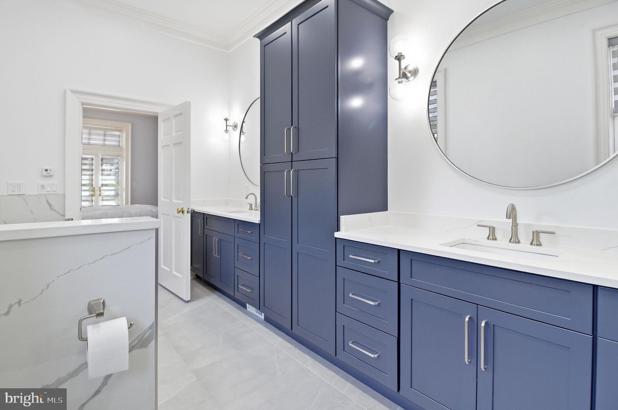 1711 Highland Road Fredericksburg, VA 22401 - Photo 20 of 58 a spacious bathroom with a double vanity sink mirror and toilet