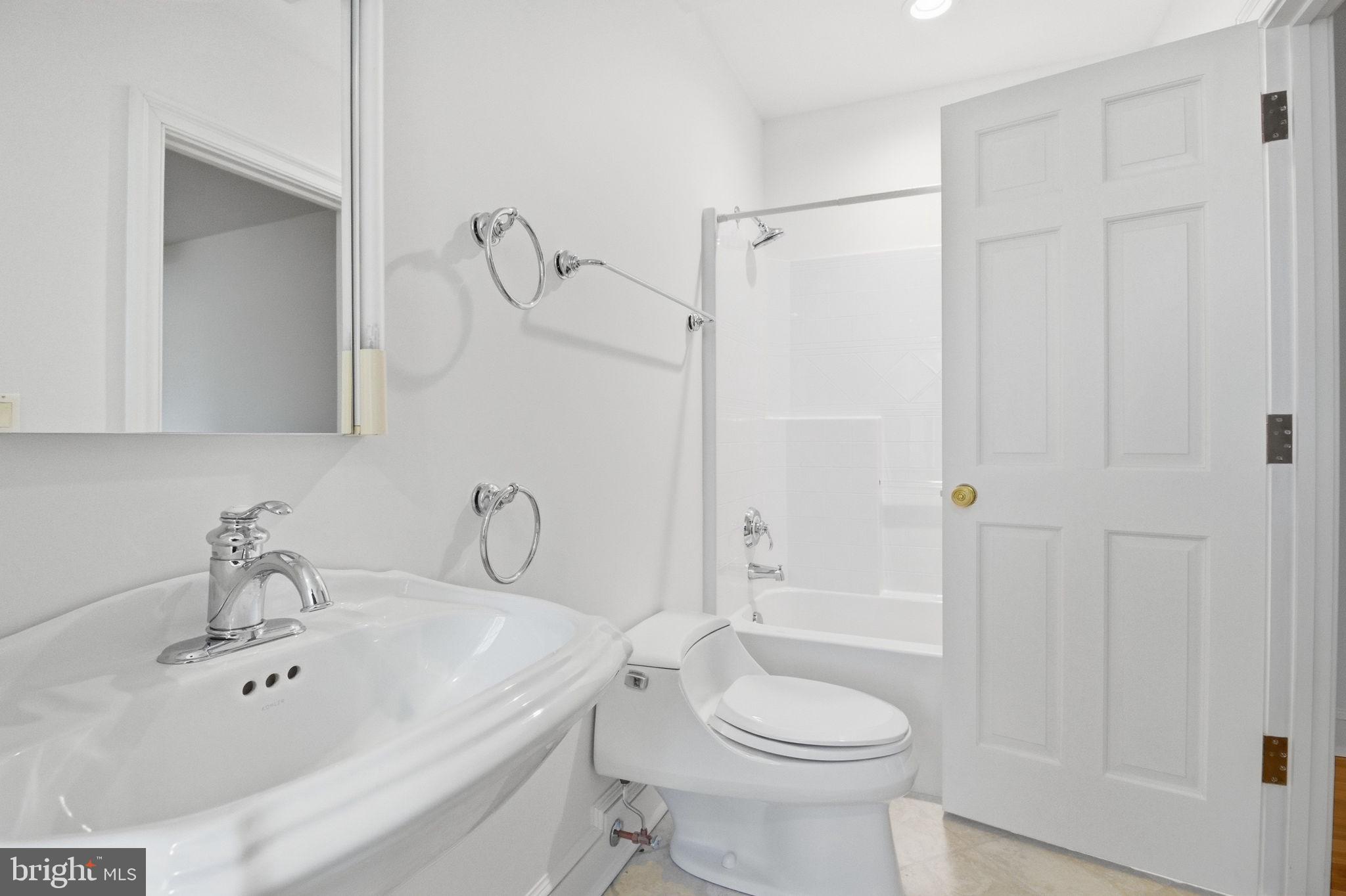 1711 Highland Road Fredericksburg, VA 22401 - Photo 26 of 58 a bathroom with a sink a toilet and shower