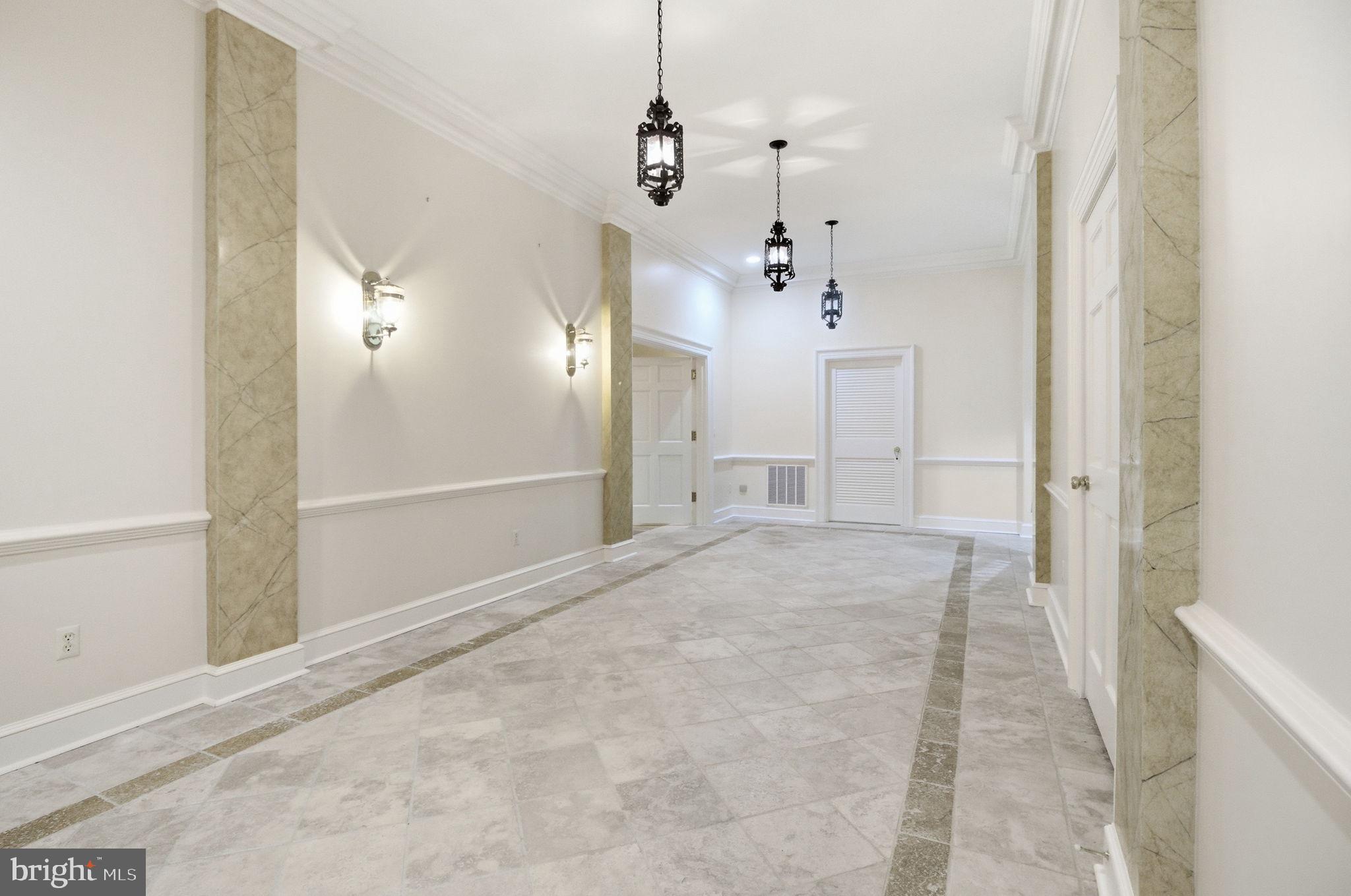 1711 Highland Road Fredericksburg, VA 22401 - Photo 28 of 58 a view of a hallway with a chandelier
