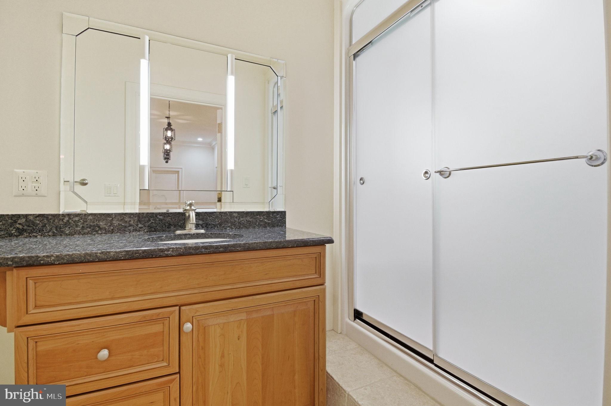 1711 Highland Road Fredericksburg, VA 22401 - Photo 34 of 58 a bathroom with a granite countertop sink and a mirror