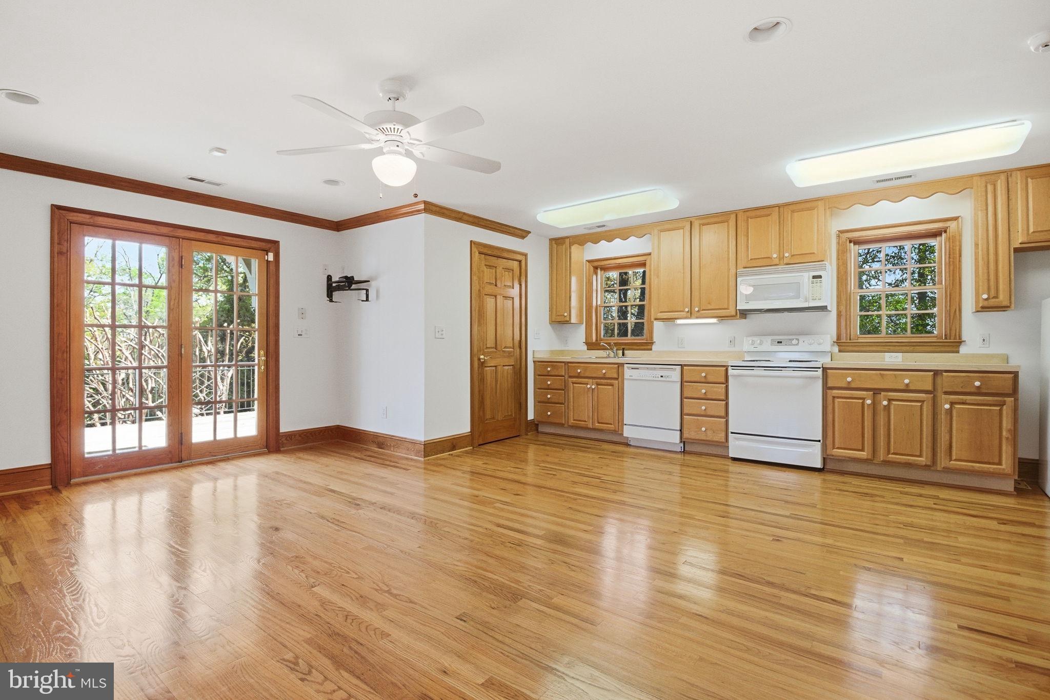 1711 Highland Road Fredericksburg, VA 22401 - Photo 38 of 58 a view of a kitchen with a stove cabinets and wooden floor