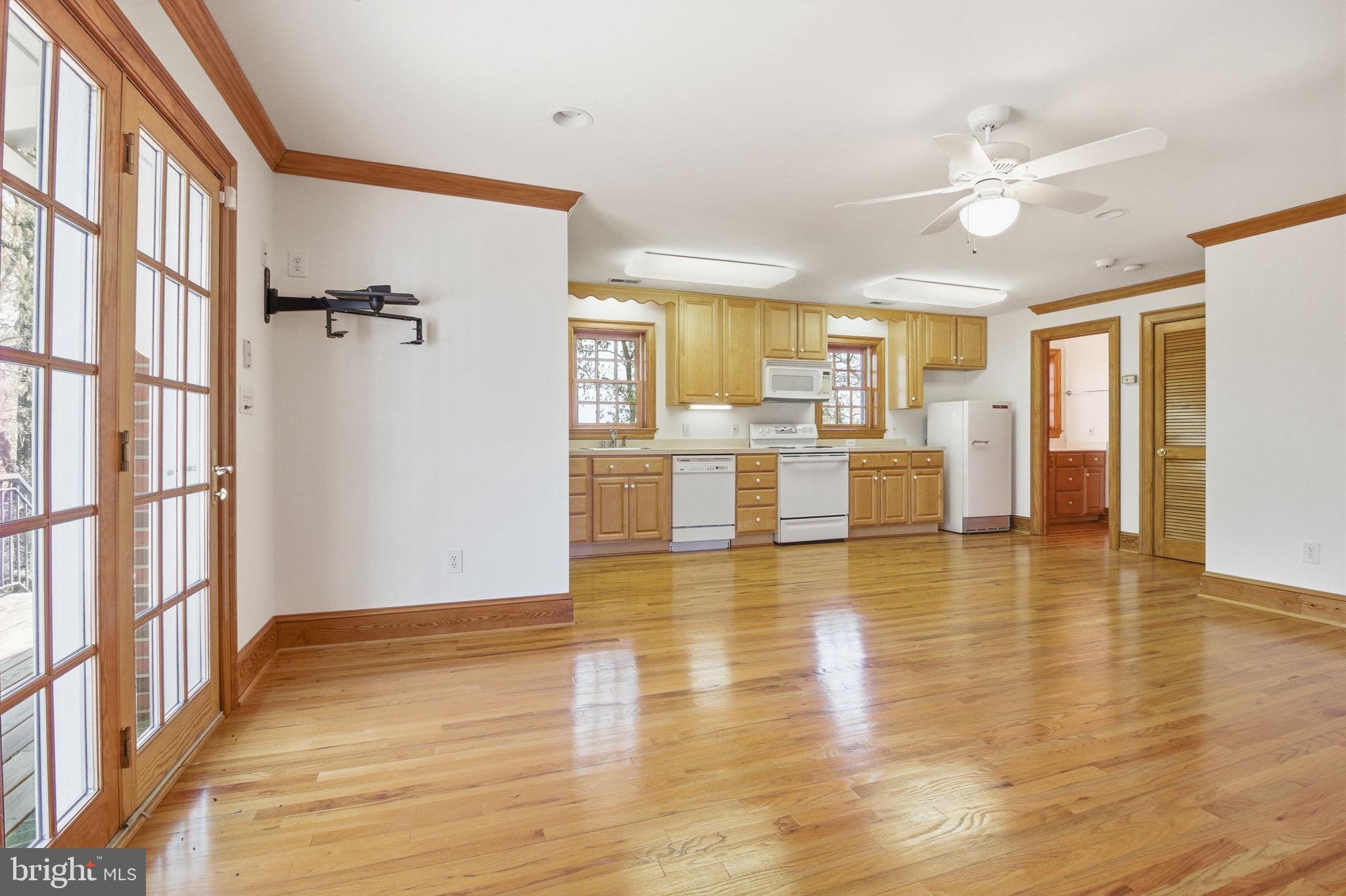 1711 Highland Road Fredericksburg, VA 22401 - Photo 40 of 58 a view of a livingroom with furniture wooden floor and a kitchen