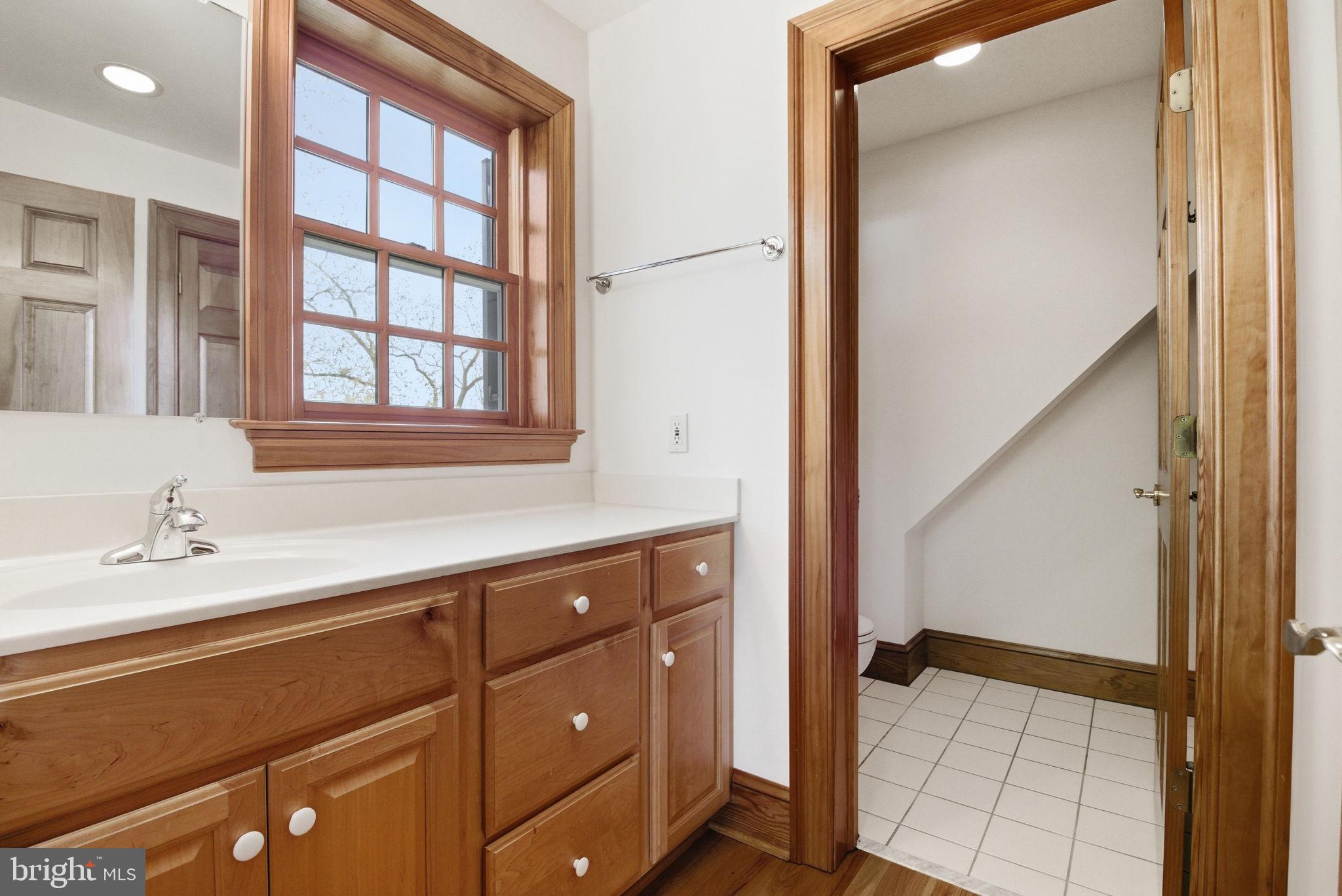 1711 Highland Road Fredericksburg, VA 22401 - Photo 44 of 58 a bathroom with a sink and a mirror