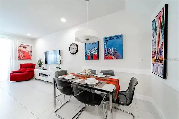 a dining room with furniture and window