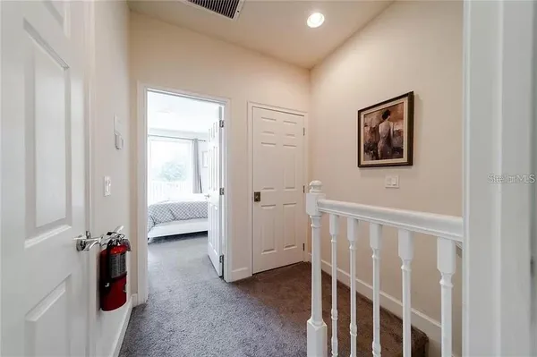 a view of a bedroom with a furniture and closet area
