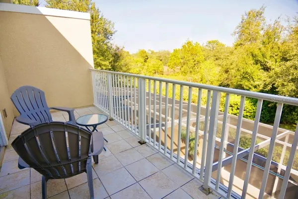 a view of balcony with wooden floor